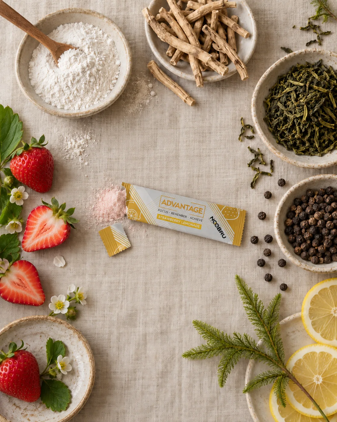 The Noobru Advantage sachet surrounded by its natural ingredients, including ashwagandha root, green tea leaves and black pepper.
